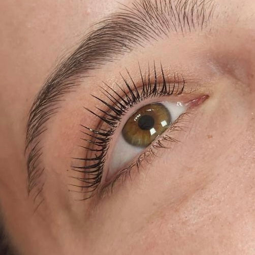 Close-up of a person's eye with lash lift and tint.