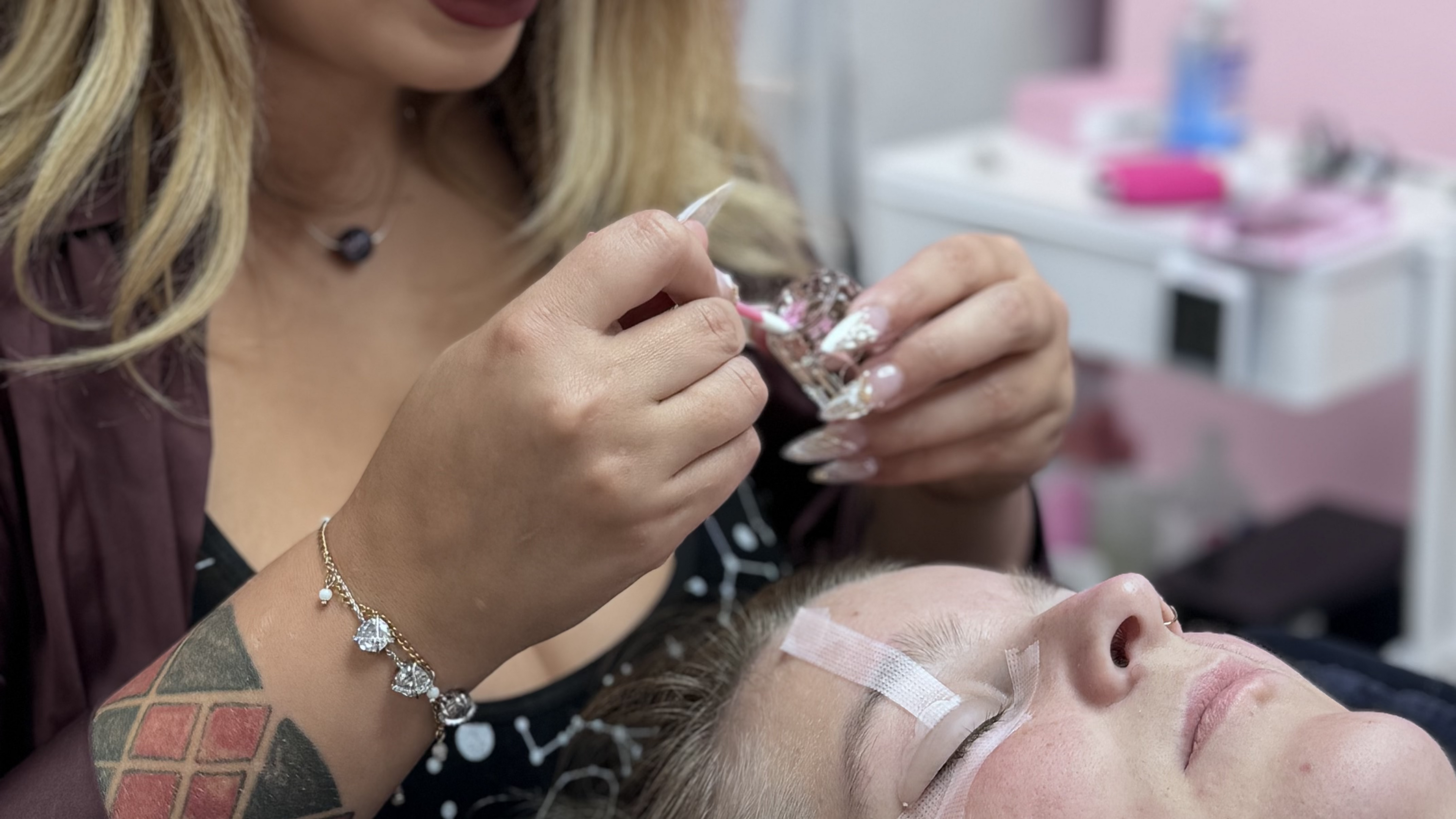 woman getting lash lift & tint