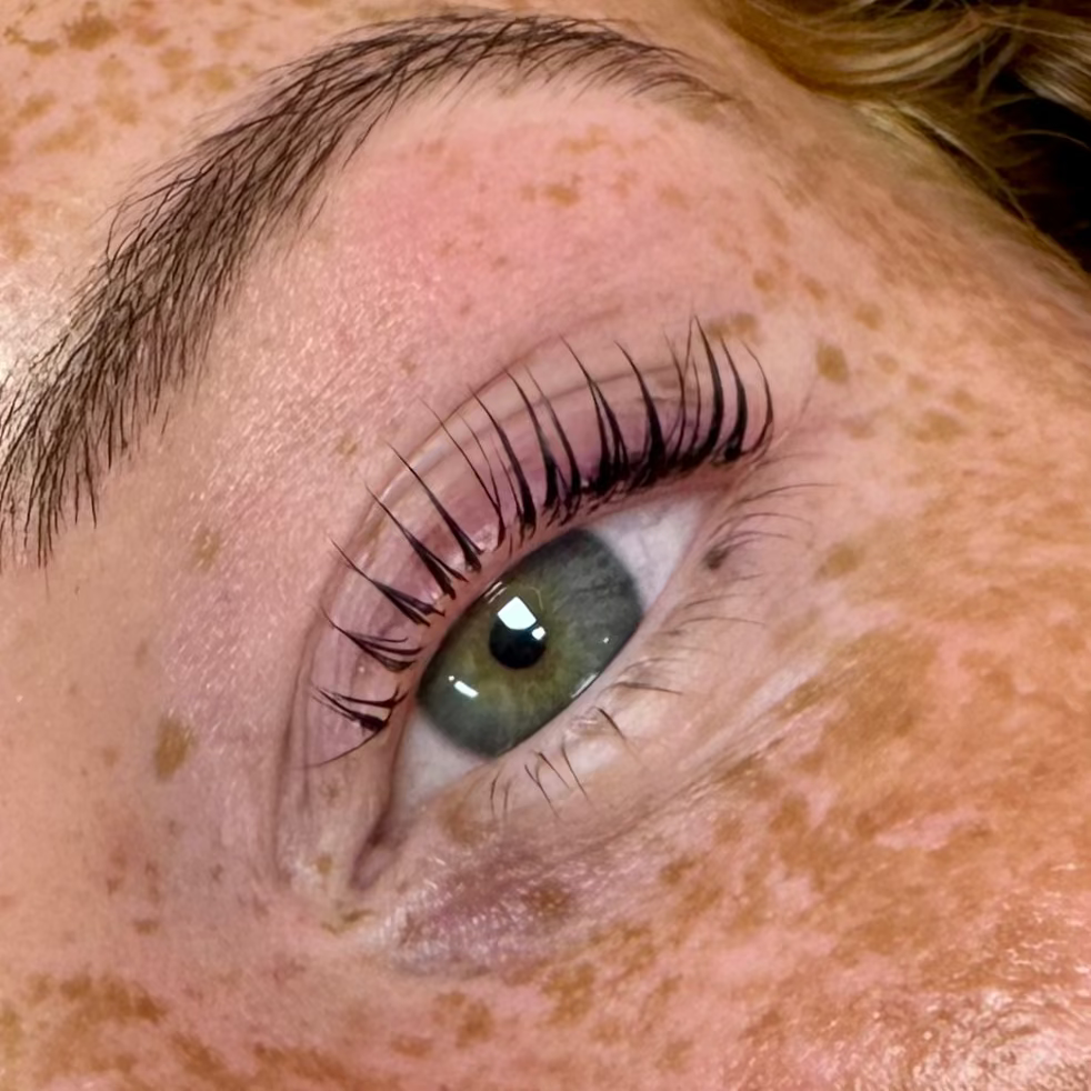 Close-up of a person's eye with lash lift and tint
