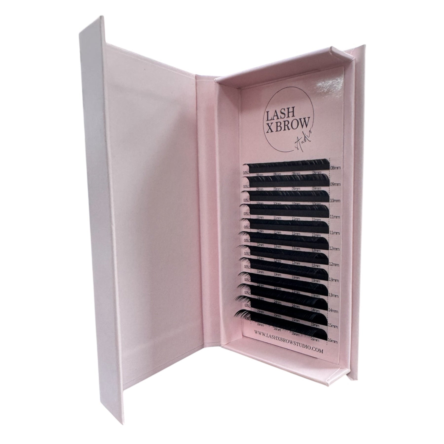 Open lash extension box containing false eyelashes with 'LASH X BROW Studio' branding on a white background