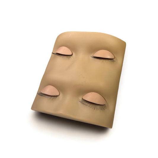 Upgraded lash training mannequin head with four reusable practice eyes featuring pre-attached lashes for realistic lash extension practice.